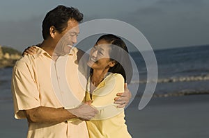 Couple Embracing On Beach