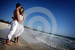 Couple embracing on beach