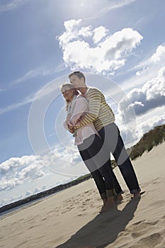 Couple Embracing On Beach