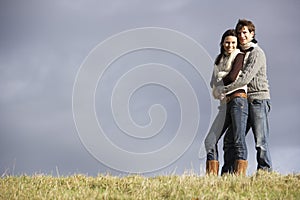 Couple Embracing In Park