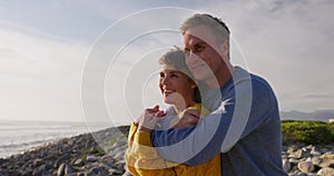 Couple embracing by the sea