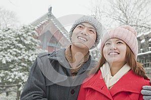 Couple embracing in snow