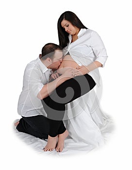 Couple embracing their pregnancy. isolated
