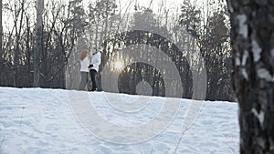 Couple embracing in winter park