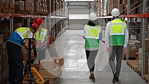 Couple of engineers during work in factory storage