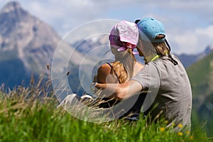 Couple enjoing a mountains view photo