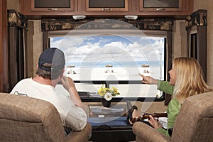 Couple Enjoy Beach View From RV