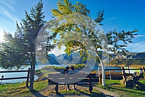 A couple enjoy a calm landscape photo