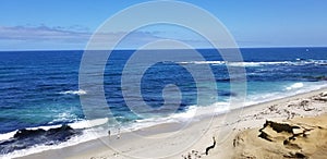 Beach time in the sun and sand on the Pacific Ocean - La Jolla, California