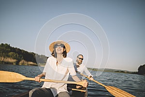 Couple enjoy summer canoe ride