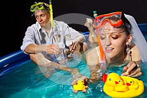 Couple is enjoyin in pool