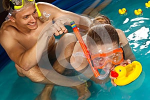 Couple is enjoyin in pool