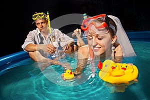 Couple is enjoyin in pool