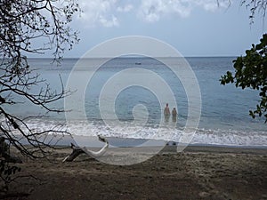 A couple enjoying a beautiful beach in the caribbean