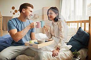 Couple Enjoying Breakfast in Bed