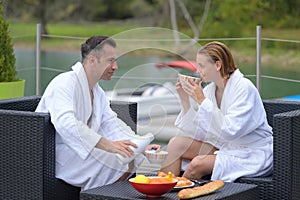couple enjoying breakfast on outdoors photo