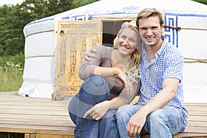 Couple Enjoying Camping Holiday In Traditional Yurt photo