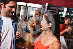 Couple enjoying champagne in nightclub