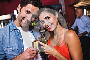 Couple enjoying champagne in nightclub