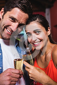 Couple enjoying champagne in nightclub