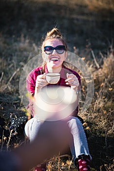 Couple enjoying a cup of coffee outdoors