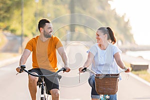 Couple enjoying a cycle ride along the seacoast