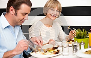 Couple enjoying delicious breakfast