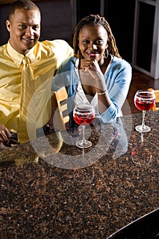 Couple enjoying drinks at a bar