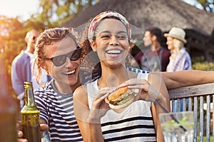 Couple enjoying food and drinks at party