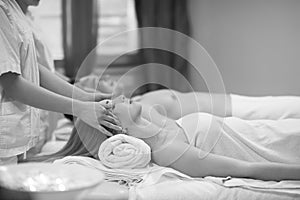 Couple enjoying head massage at the spa