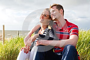 Couple enjoying holiday in beach dune