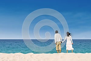 Couple enjoying honeymoon at the beach