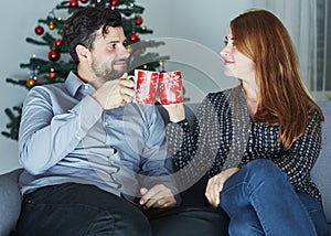 Couple enjoying hot tee or coffee