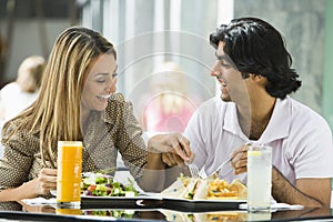 Couple enjoying lunch at cafe