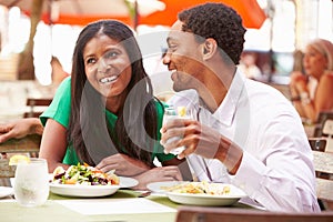 Couple Enjoying Lunch In Outdoor Restaurant