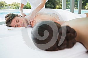 Couple enjoying massage at health farm