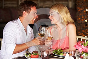 Couple Enjoying Meal In Restaurant