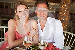 Couple Enjoying Meal In Restaurant