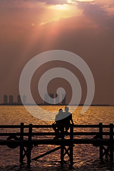 Couple Enjoying Romantic Sunset