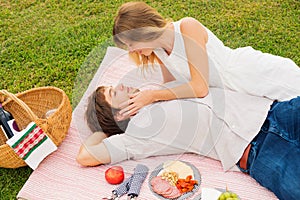 Couple Enjoying Romantic Sunset Picnic