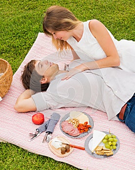 Couple Enjoying Romantic Sunset Picnic