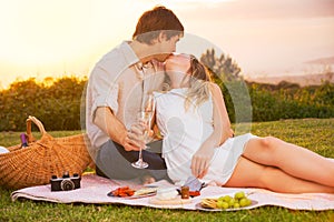 Couple Enjoying Romantic Sunset Picnic