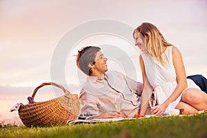 Couple Enjoying Romantic Sunset Picnic