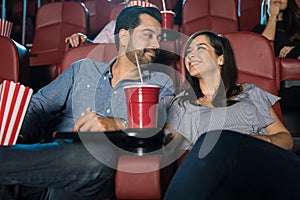 Couple enjoying their date at the movies