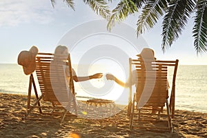 Couple enjoying their summer vacation on sandy beach