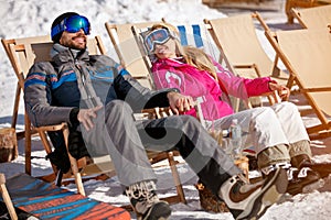 Couple enjoying together in sun at mountains