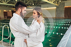 Couple enjoying treatments and relaxing at wellness spa center