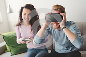 Couple enjoying VR and playing games