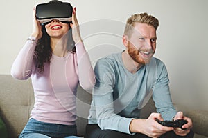 Couple enjoying VR and playing games