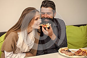 Couple enjoys pizza. Couple eating pizza